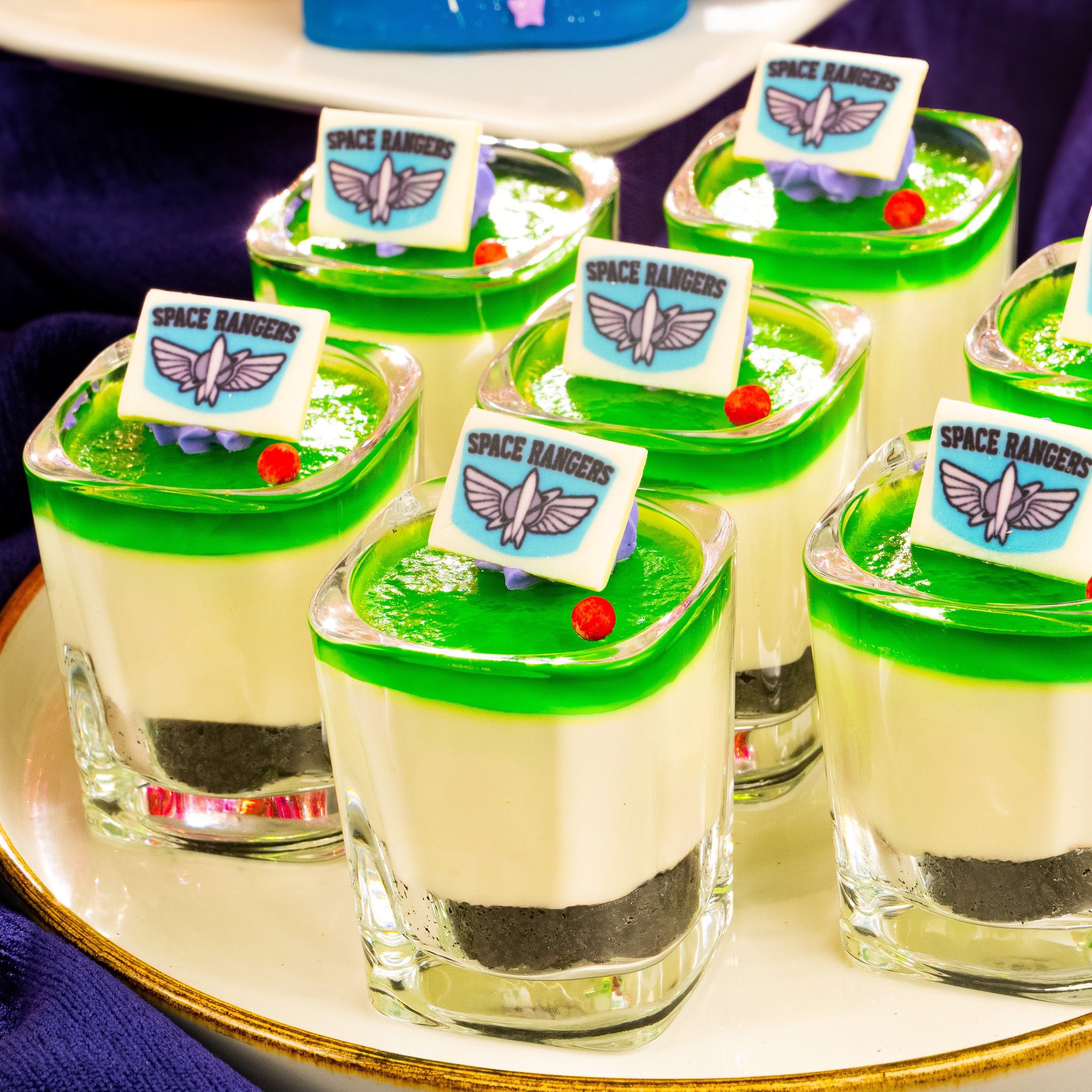 🍰✨ Sweet Surprises Await! New Land-Inspired Treats at Magic Kingdom’s Fireworks Dessert Party 🎆 Starting October 8, Disney is sprinkling even more sweetness into your night at Magic Kingdom’s Fireworks Dessert Party at the Tomorrowland Terrace Restaurant! Guests can now indulge in an all-new lineup of land-inspired desserts — each treat celebrating one of Magic Kingdom’s beloved lands. Whether you’re watching the sky light up over Cinderella Castle or snapping your next sweet pic for the ‘gram, these new creations are as magical as the fireworks themselves. 🍫 Land-Inspired Delights You Can’t Miss ✨ Star Command Mousse Cup (Tomorrowland) – A galactic swirl of chocolate and vanilla mousse topped with a space-worthy crunch. Buzz Lightyear would totally approve! 🚀 🍑 Bayou Peach Cobbler (Frontierland) – Warm, golden cobbler filled with juicy peaches and a sprinkle of southern charm straight from the bayou. 🌙 🧀 Country Bear Cheesecake (Frontierland) – Creamy, dreamy cheesecake with a berry topping that’s sure to make you clap your paws! 🐻 🍎 Fantasyland Apple Tart – A flaky, fairytale-perfect pastry fit for a princess, complete with shimmering sugar dust. 🍏 🍰 Main Street Vanilla Bean Cake Bites – Sweet, simple, and picture-perfect — the perfect companion to a front-row fireworks view. 🎇 These desserts are available as part of the Magic Kingdom Fireworks Dessert Party at Tomorrowland Terrace, where guests can enjoy exclusive seating, sweet treats, and a sparkling view of the nightly fireworks spectacular. So grab your plate, pick your favorite flavor, and make your night extra magical — because fireworks taste even better with a side of Disney dessert! 💫